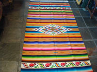 Mexican vintage textiles and sarapes, a lovely Saltillo sarape with a wonderful center diamond of silk, c. 1920's. The predominant color is a lovely golden tan, with very colorful intermittant bands. Another photo of center of saltillo.