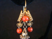 Mexican vintage jewelry, a beautiful pair of gold and coral earrings in a traditional colonial style, c. 1900. Another closeup photo of the bottom part of one earring.