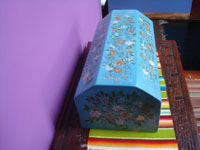 Mexican vintage folk art, a very beautiful lacquer-ware chest or baul with a wonderful blue background and beautiful artwork, Uruapan, Michoacan, c. 1940's.  A side view of the chest.