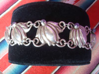 Mexican vintage sterling silver jewelry, and Taxco vintage sterling silver jewelry, a beautiful sterling silver bracelet with floral pendants and cabochons of amethyst, Taxco, c. 1940.  Another side view of the bracelet.