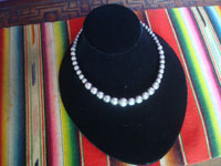 Native American Indian sterling silver jewelry, and Navajo vintage sterling silver jewelry, a beautiful necklace with a single strant of silbver beads, Arizona or New Mexico, c. 1950's. Main photo of the Navajo necklace.