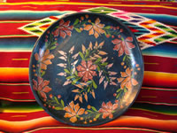 Mexican wood carving, Olinala laquerware charger, c. 1940.