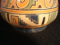 Mexican vintage pottery and ceramics, a pottery vase from Tonala, Jalisco, c. 1930. The vase has wonderful Aztec designs and very fine petatillo (straw-like hatching in the background) in many areas. Closeup photo near base.