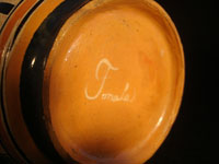 Mexican vintage pottery and ceramics, a pottery vase from Tonala, Jalisco, c. 1930. The vase has wonderful Aztec designs and very fine petatillo (straw-like hatching in the background) in many areas. Closeup photo of signature on bottom of vase.