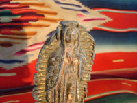 Mexican vintage devotional art, a pot-metal Virgen of Guadalup, c. 1930's. The Virgen is extremely beautiful. This is an incredible piece of Mexican fine/folk art and devotional art. Closeup photo of the Virgen.