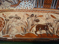 Mexican pottery and ceramics, a large rectangular pottery dish from Tonala, date December 18, 1995. The dish is signed, S. Lucano for the late Santos Lucano Neri, a famous Tonala potter and member of a famous family of potters and artisans. Another scene.