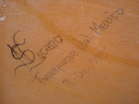 Mexican pottery and ceramics, a large rectangular pottery dish from Tonala, date December 18, 1995. The dish is signed, S. Lucano for the late Santos Lucano Neri, a famous Tonala potter and member of a famous family of potters and artisans. The artists signature on the bottom of the dish.