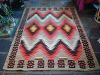 Native American Indian vintage textile, a Navajo Red-Mesa weaving, c. 1930-1940. The border shows a Tees Nos Pas influence. Very well woven with an eye-dazzler center design. Main photo.