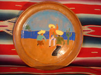 American vintage pottery, a San Jose plate from the San Jose Company in Texac, c. 1930. The plate is decorated with a scene of a Mexican cockfight, and is extremely well done.