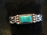 Native American Indian vintage sterling silver jewelry, and Navajo vintage silver jewelry, a beautiful Navajo sterling silver bracelet with a wonderful turquoise stone, Arizona or New Mexico, c. 1950's. Main photo of the Navajo silver bracelet.