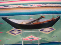 Native American Indian vintage folk art and woodcarving, a graceful and lovely model Nootka boat with oars, West Coast of Vancouver Island, British Columbia, c. 1960's. Main photo of the boat.