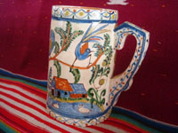 Mexican vintage pottery and ceramics, a beautiful pottery pitcher with fabulous artwork featuring graceful quetzales, birds, blue deer and ducks, surrounded by wonderful floral designs, Tonala or San Pedro Tlaquepaque, c. 1930's. Main photo of the pitcher.