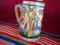 Mexican vintage pottery and ceramics, a beautiful pottery pitcher with fabulous artwork featuring graceful quetzales, birds, blue deer and ducks, surrounded by wonderful floral designs, Tonala or San Pedro Tlaquepaque, c. 1930's. A third side of the pitcher.