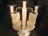 Mexican vintage tin or tinwork art, a candlelabra with beautiful form and simple stamping, c. 1930-40. This is a truly elegant piece of vintage Mexican tinwork.