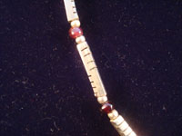 Mexican vintage silver jewelry and Taxco vintage silver jewelry, a sterling silver neclace with small rose garnet beads, signed Los Castillo, c. 1950. Closeup.