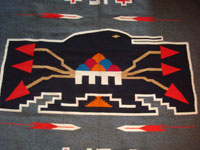 New Mexican vintage textile, a finely woven rug from the weaving center of Chimayo, New Mexico, c. 1930. This is from a very famous weaver, active from 1910-40, whose signature was the hummingbird in the center of this textile. Another closeup.