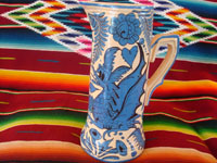 Mexican vintage pottery and ceramics, a large Fantasia-style pitcher, Tlaquepaque, c. 1930. Whimsical blue decorations on a cream-colored glaze, with dragons, flowers, leaves; all exquisitely painted. A third view of pitcher.