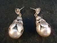 Mexican vintage silver jewelry and vintage Taxco silver jewelry, a pair of Mexican sterling silver earrings, c. 1930's. These features beautiful leaves around globular fruit, very much resembling a pomegranate. Another view.