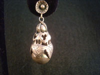 Mexican vintage silver jewelry and vintage Taxco silver jewelry, a pair of Mexican sterling silver earrings, c. 1930's. These features beautiful leaves around globular fruit, very much resembling a pomegranate. Closeup.