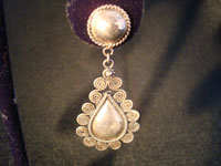 Mexican vintage silver jewelry, and vintage Taxco silver jewelry, a wonderful pair of earrings, c. 1930-40. They have exquisite silver-work and a unique tear-drop shape. Closeup photo.