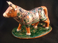 Mexican vintage pottery and ceramics, and Mexican vintage folk art, a pottery bull with fine hand-painted decoration, c. 1950. Signed on the bottom, Jose Trinidad Bernabe Lopez, Tonala, Jalisco Mexico.