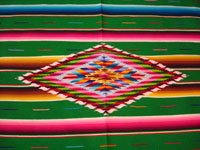 Mexican vintage sarapes and textiles, a beautiful Saltillo sarape with a green background and wonderful center diamond of silk, c. 1930's. Closeup photo of the center diamond.