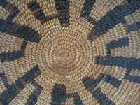 Native American Indian vintage basket, a Papago tray decorated with graceful Saguaro cacti, c. 1900. The weaving is very tight and fine, typical of earlier Papago basketry. Closeup photo of the center of the Papago Indian basket.