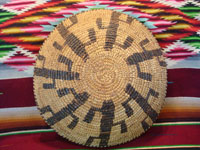 Native American Indian vintage basket, a Papago tray decorated with graceful Saguaro cacti, c. 1900. The weaving is very tight and fine, typical of earlier Papago basketry. Photo of the back side of the Papago Indian basket.