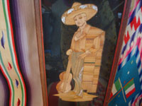 Mexican vintage straw-art (popote art or popotillo), a pair of straw-art scenes depicting a lovely China Poblana and her valiant Charro with his guitar, Mexico, c. 1930's.  Closeup of the image of the Charro.