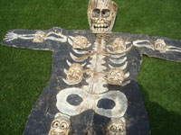 A wonderful Guerrero dance costume of the celebration of the Day of the Dead, the morality play of life and death, Guerrero, c. 1950. Closeup photo of the costume.