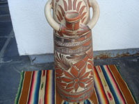 Mexican vintage folk art, a pottery statue of a shaman, Guerrero, c. 1960. The statue is beatifully formed and decorated. The statue is from the village of Amayaltepic. Photo of the decorations on the front of the shaman.