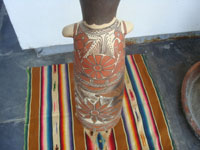 Mexican vintage folk art, a pottery statue of a shaman, Guerrero, c. 1960. The statue is beatifully formed and decorated. The statue is from the village of Amayaltepic. Photo of the decorations near the base of the shaman.