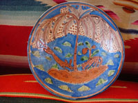 Vintage Mexican pottery and ceramics, and Mexican vintage folk art, a pair of lovely pottery plates from Tlaquepaque, c. 1920-30's. These are attributed to the famous artist, Balbino Lucano (or his equally famous brother, Tomas Lucano). Closeup photo of one of the plates.
