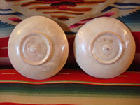 Vintage Mexican pottery and ceramics, and Mexican vintage folk art, a pair of lovely pottery plates from Tlaquepaque, c. 1920-30's. These are attributed to the famous artist, Balbino Lucano (or his equally famous brother, Tomas Lucano). Photo of the back sides of both plates.
