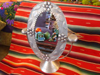 Mexican vintage tin art, a wonderfully stamped tin-work mirror, c. 1945. The mirror swivels up and down. It is extremely beautiful and very well-done! Main photo.