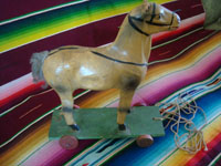 Mexican vintage folk art, a wonderful paper mache horse on wheels and pulled with a string, c. 1940's. Main view of the horse.