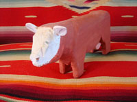 Native American Indian folk art, Navajo wood carving of a bull by Johnson Antonio, 1992.