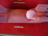 Navajo wood carving, a bull by Johson Antoio, closeup photo of signature on bottom.