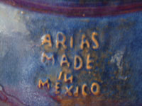 Closeup photo of the Arias mark on the back of the Tlaquepaque charger.