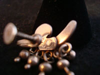 Los Castillo earrings, photo of signature.
