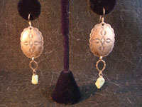 Native American vintage jewelry, stamped silver earrings with turquoise stones dangling at ends, c. 1940's.