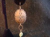 Navajo vintage silver earrings, closeup photo.