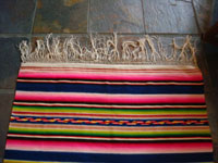 Closeup photo of blue sarape end stripe and fringe