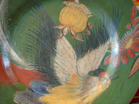 Closeup photo of Tonala charger with exotic bird