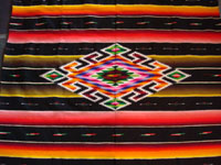 Mexican Saltillo sarape with Mexican flag colors, closeup of center diamond