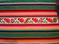 Green Saltillo sarape, closeup of end-bar with roses