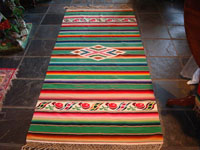 Mexican vintage textile, Saltillo sarape with green background, c. 1940.