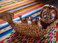 Side view of mermaid with crown