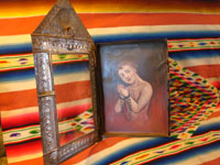 Photo showing open nicho with retable of soul in purgatory.