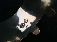 Closeup photo of Taxco silver cuff showing eagle mark with number.